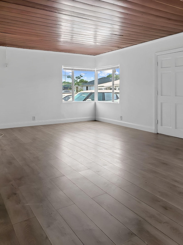 unfurnished room featuring wooden ceiling and hardwood / wood-style flooring