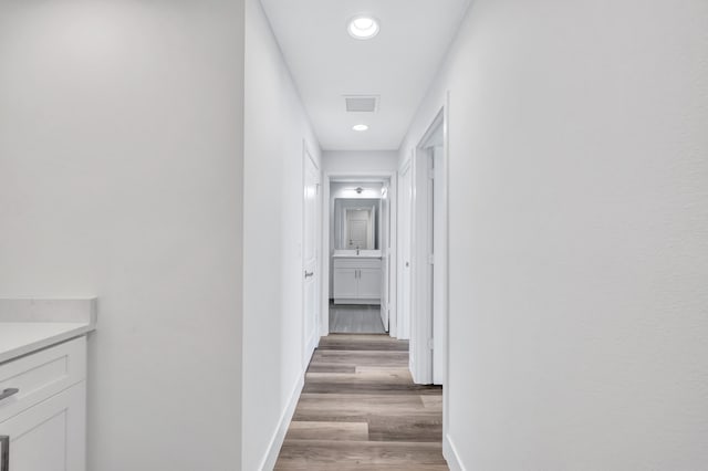 corridor with light wood-type flooring