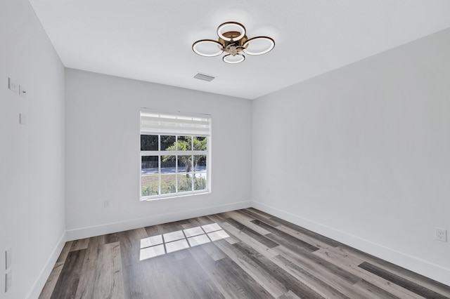 unfurnished room featuring hardwood / wood-style floors