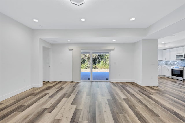 spare room featuring light hardwood / wood-style flooring