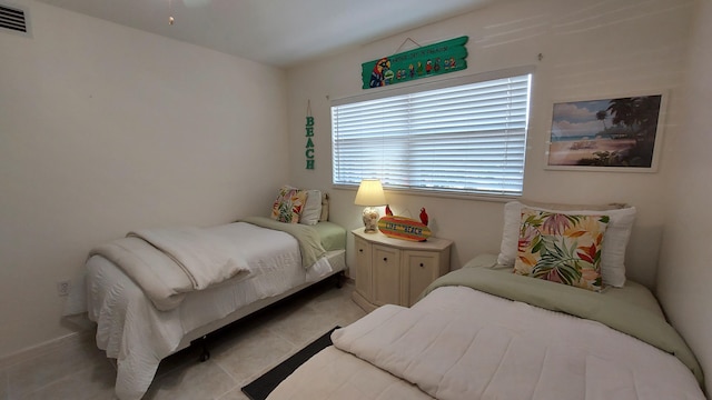 bedroom featuring light tile flooring