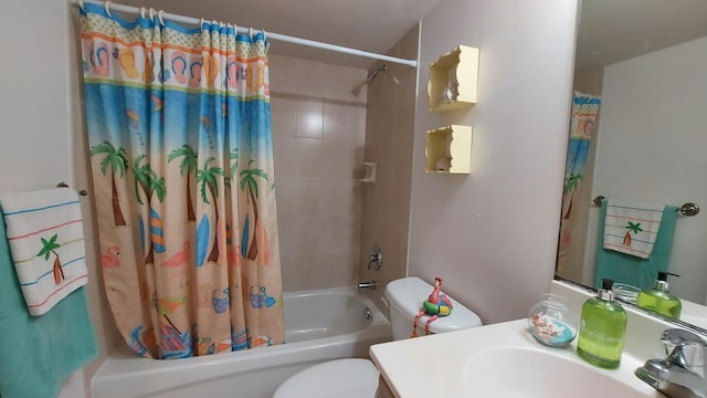 full bathroom featuring shower / tub combo, vanity, and toilet