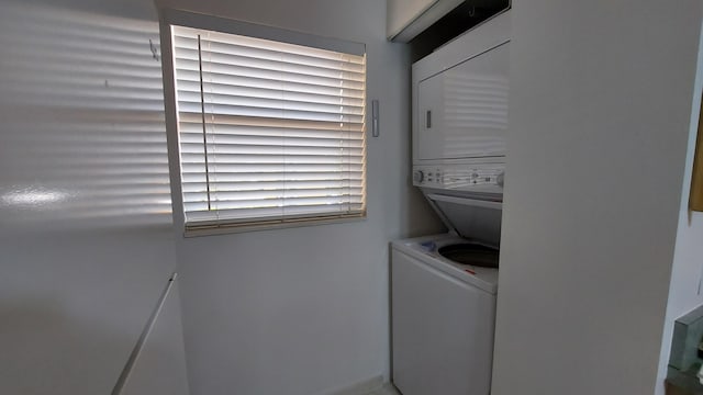 washroom featuring stacked washer and dryer