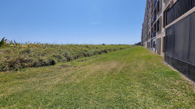 view of yard with a rural view