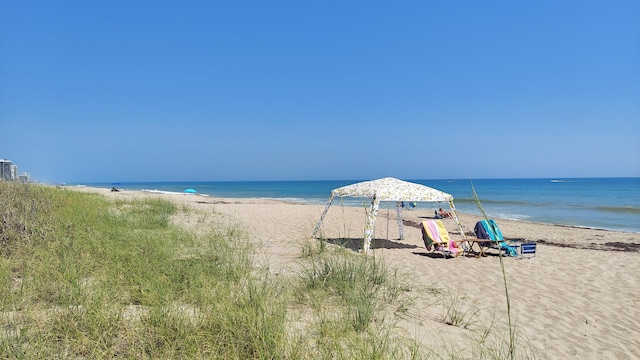 property view of water featuring a beach view