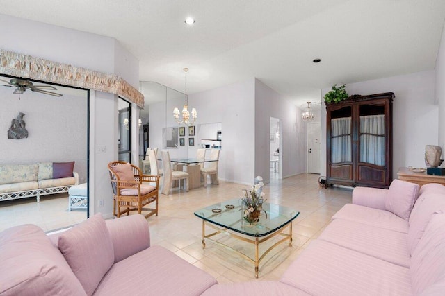 living room with ceiling fan with notable chandelier and tile flooring