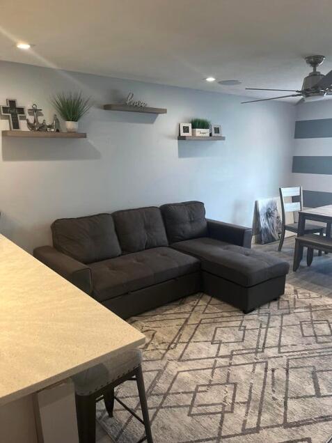 living room with ceiling fan