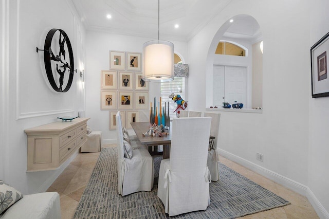 dining room featuring light tile patterned flooring and ornamental molding