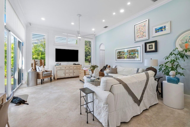 living room with ceiling fan and ornamental molding