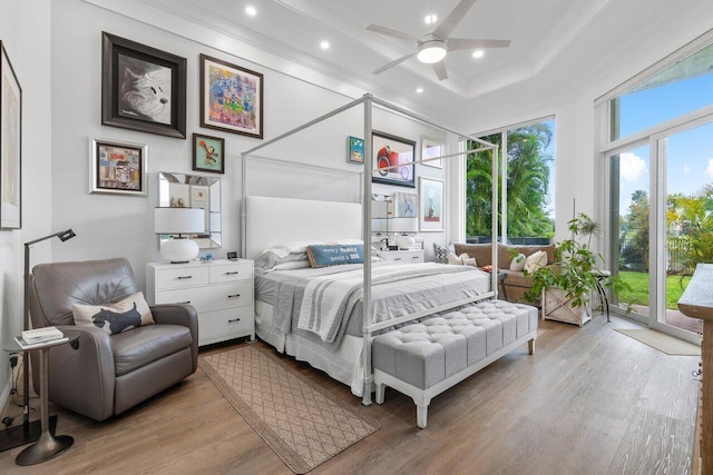 bedroom featuring ceiling fan, access to exterior, and light wood-type flooring