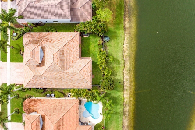 birds eye view of property with a water view