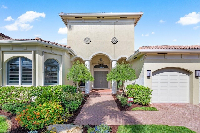 mediterranean / spanish-style home featuring a garage