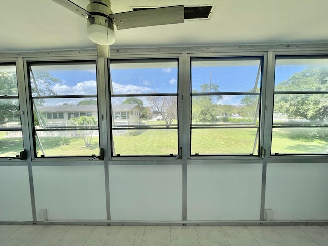 interior space featuring ceiling fan