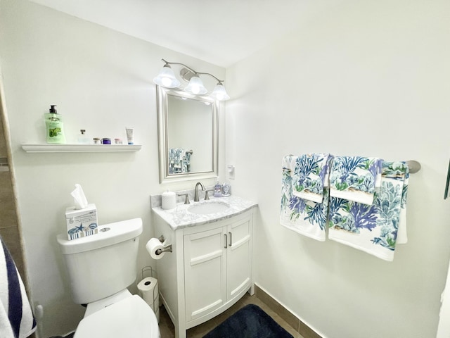 bathroom with toilet and oversized vanity