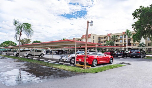 view of vehicle parking featuring a carport