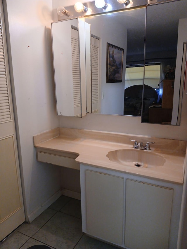 bathroom with tile flooring and large vanity