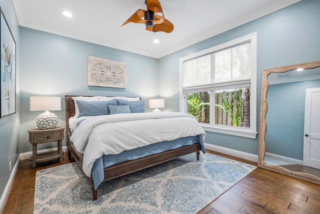 bedroom featuring crown molding, dark hardwood / wood-style floors, and ceiling fan