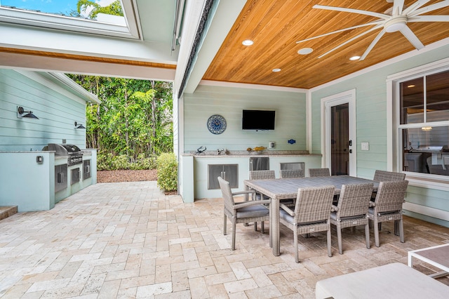 view of terrace with area for grilling and an outdoor kitchen