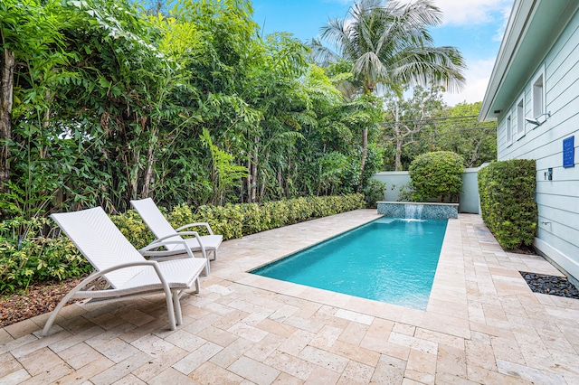 view of swimming pool with a patio and an outdoor living space