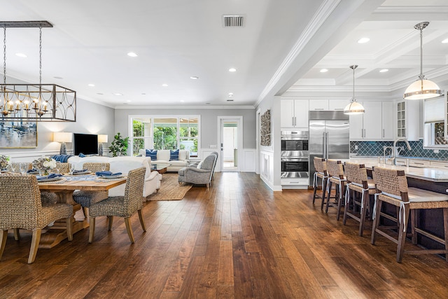 dining area featuring beamed ceiling, crown molding, coffered ceiling, and dark wood-type flooring