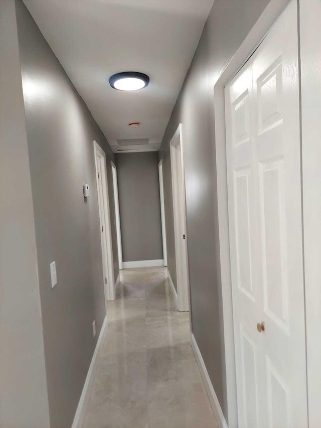 hall with light tile floors