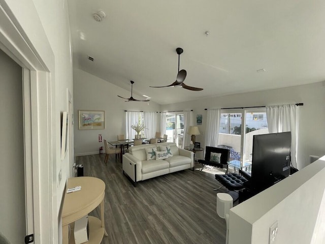 living room featuring dark hardwood / wood-style floors, ceiling fan, and vaulted ceiling