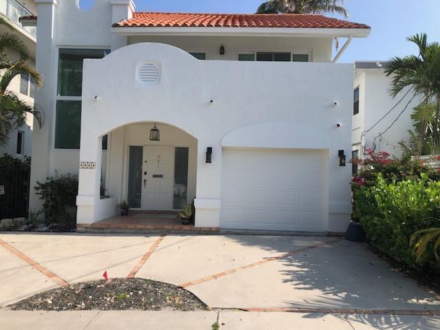 mediterranean / spanish-style home with a garage