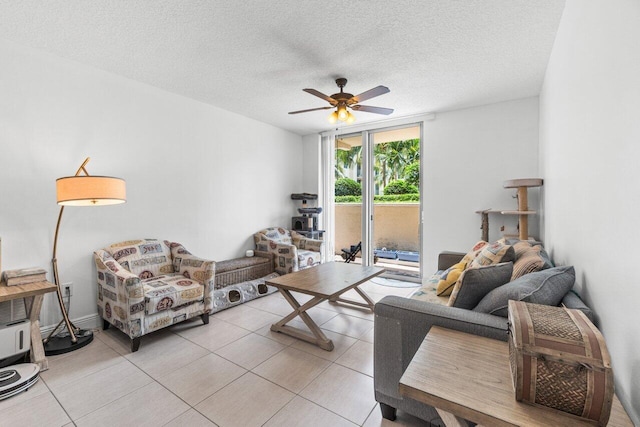 tiled living room featuring ceiling fan and a textured ceiling