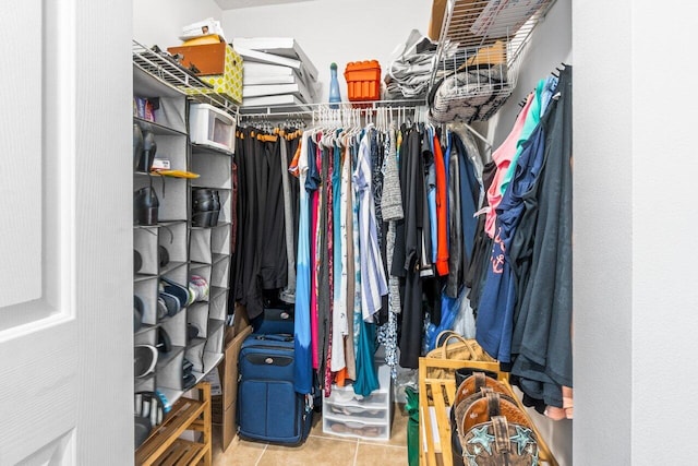 spacious closet with tile patterned flooring