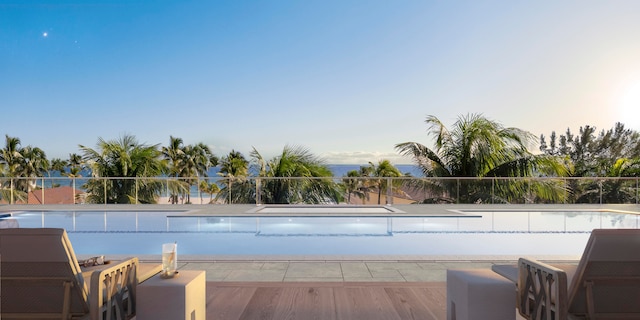 view of pool at dusk