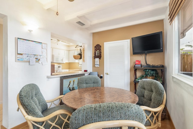 dining room with wood-type flooring