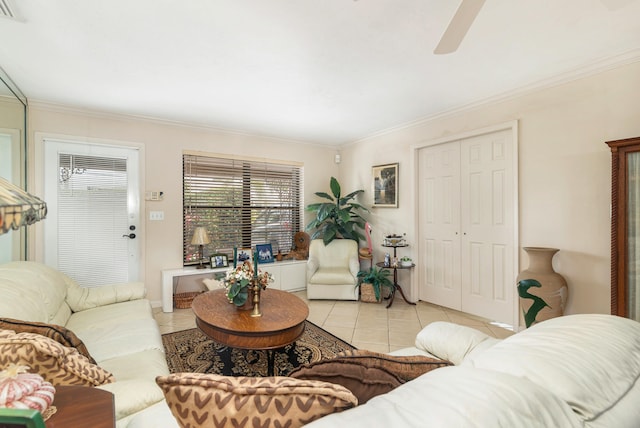 living room featuring light tile patterned floors, ceiling fan, and ornamental molding