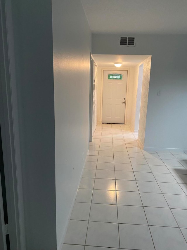 hallway with light tile floors