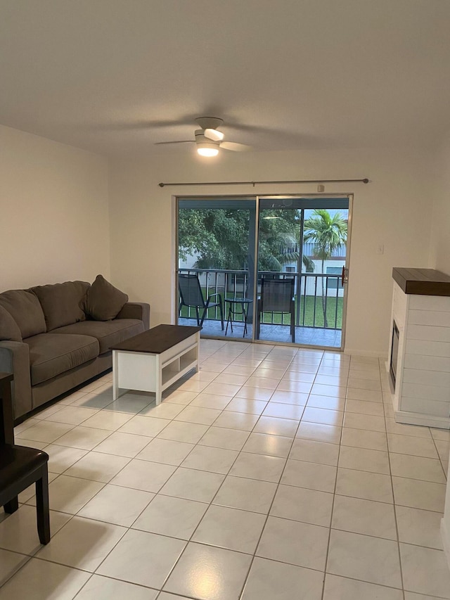 tiled living room with ceiling fan