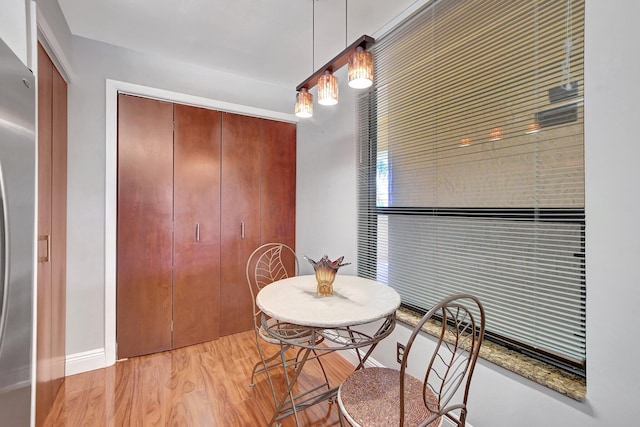 dining space with light wood-type flooring