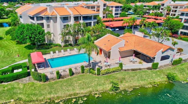 birds eye view of property with a water view