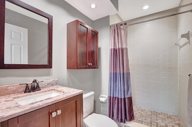 bathroom with vanity, toilet, and a shower with curtain