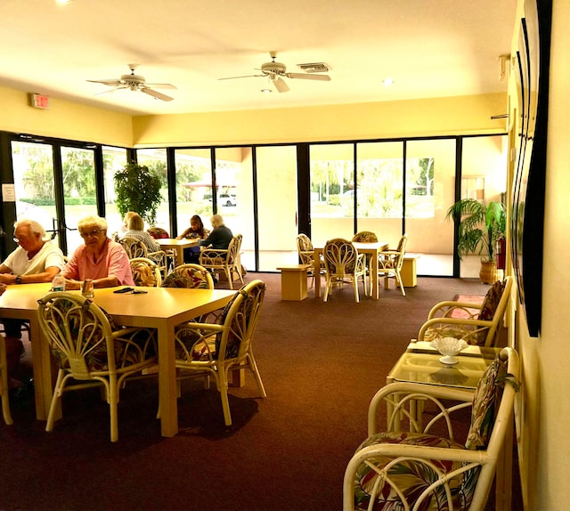 dining room with carpet flooring and ceiling fan