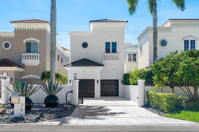 mediterranean / spanish home with a garage