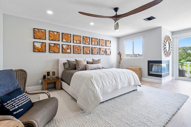 bedroom with a closet and hardwood / wood-style floors