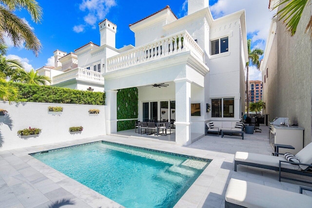 view of swimming pool featuring a patio area