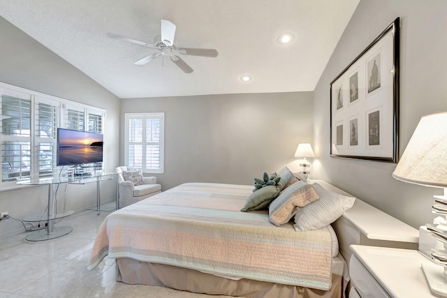 tiled bedroom featuring lofted ceiling and ceiling fan