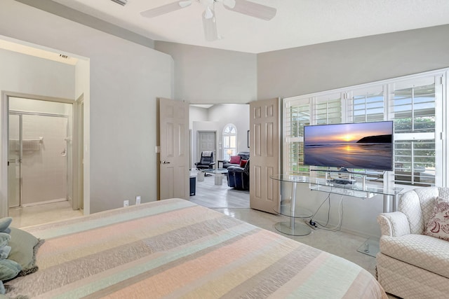 bedroom with ceiling fan and multiple windows