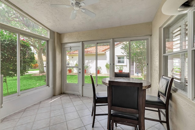 sunroom featuring a wealth of natural light and ceiling fan