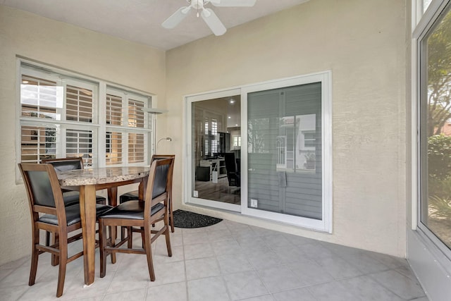 sunroom / solarium with ceiling fan and plenty of natural light