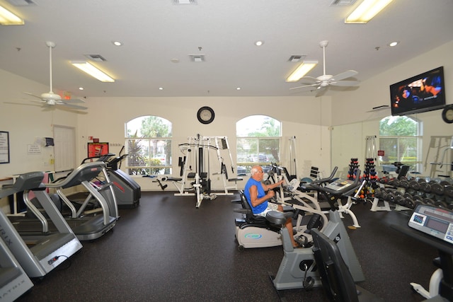 gym with vaulted ceiling and ceiling fan