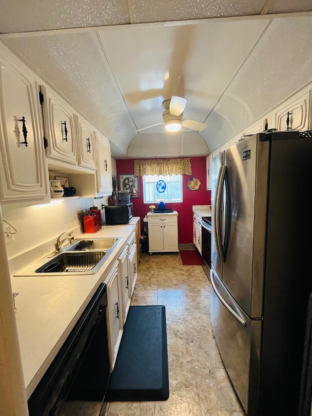 kitchen with white cabinetry, ceiling fan, sink, lofted ceiling, and black appliances