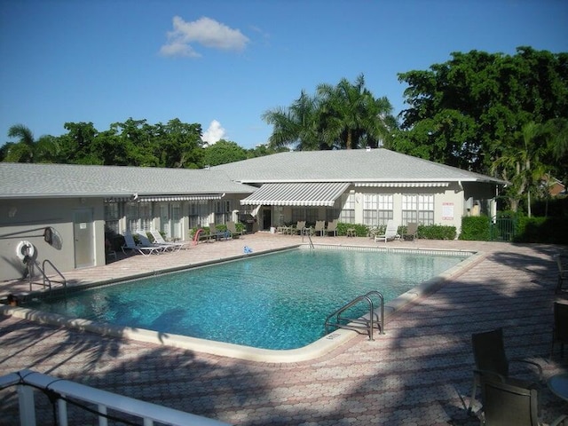 view of swimming pool with a patio area