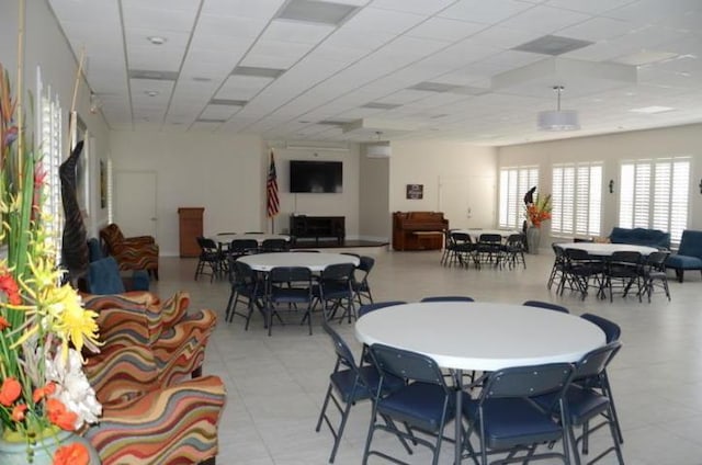 dining area with a drop ceiling