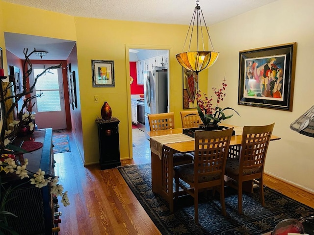 dining room featuring dark hardwood / wood-style flooring